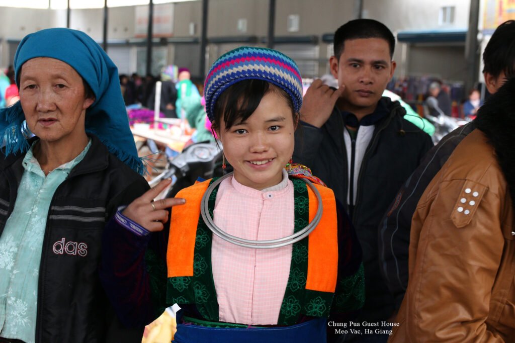 A Hmong girl is hanging out at the Meo Vac market.