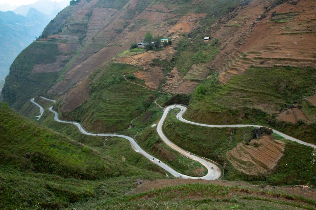 Photo show the road that leads to the boat dock for the Nho Que River boat ride through the Tu San Canyon.